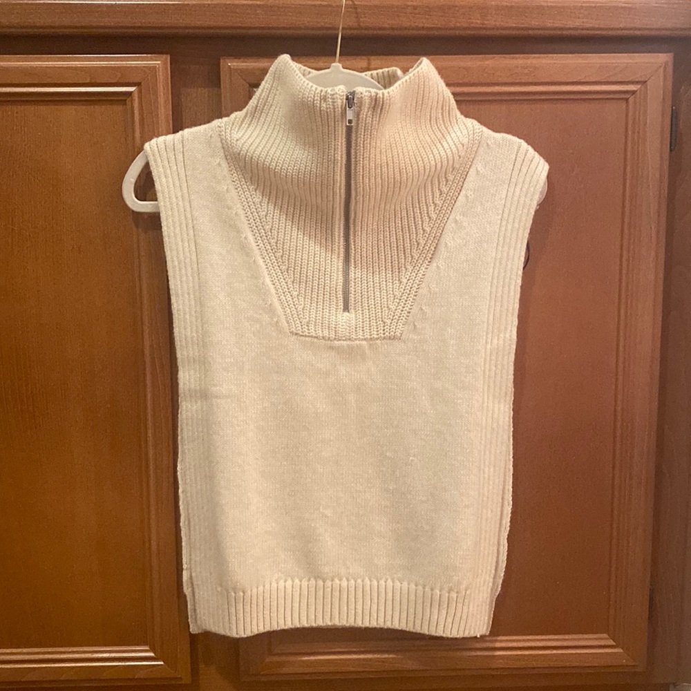 H&M Beige knitted turtle neck tunic open on the sides.